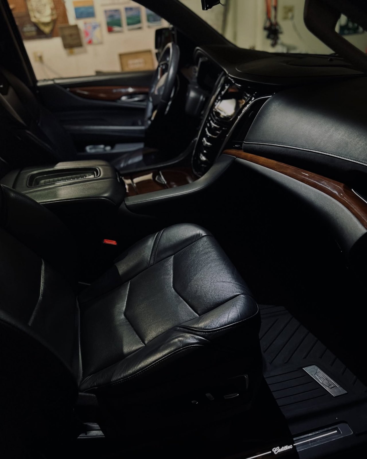 Cadillac Escalade black leather interior with wood trim after a full detail