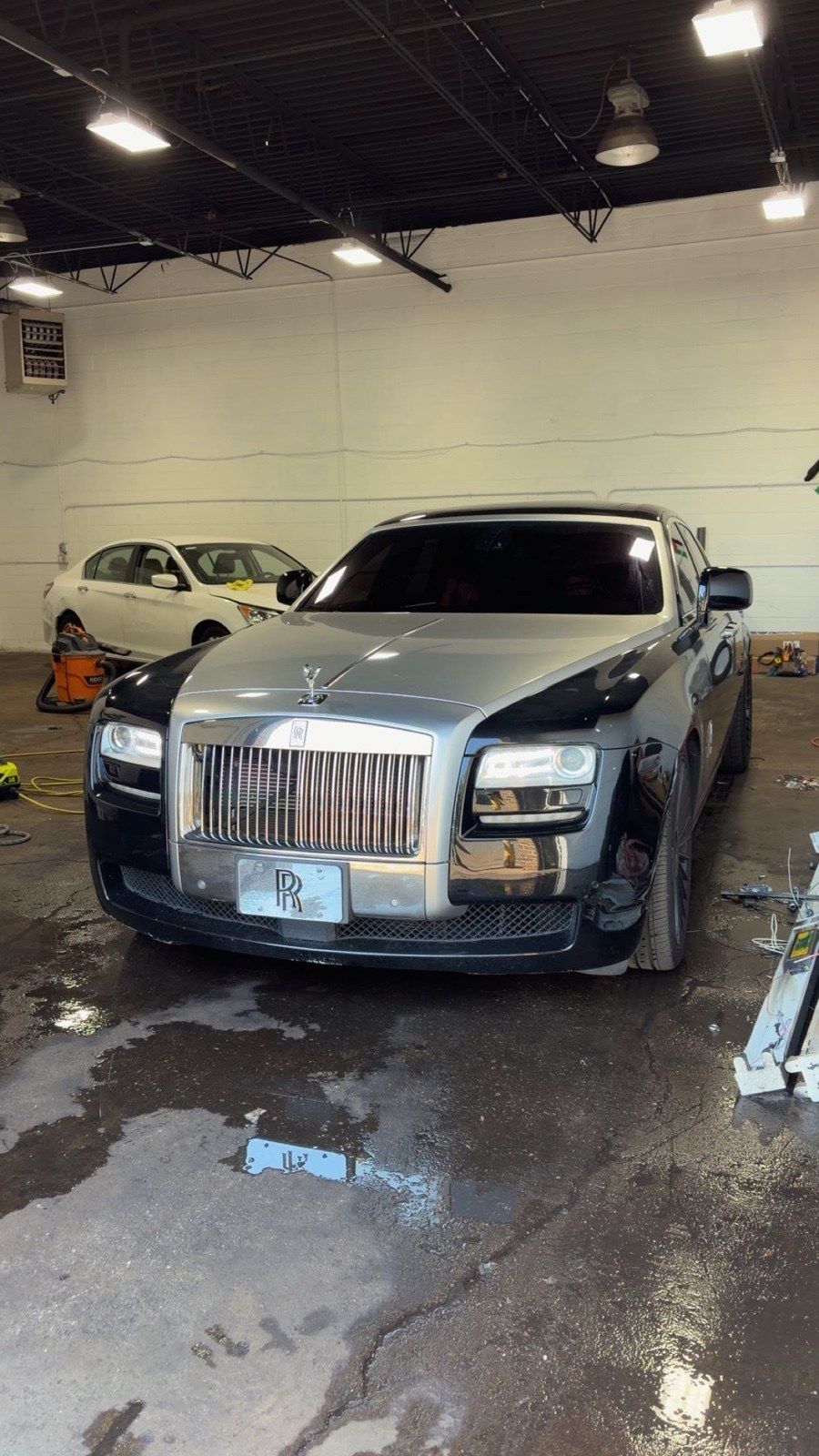 Rolls-Royce Ghost with dark ceramic window tint in the Zoom Aesthetics studio