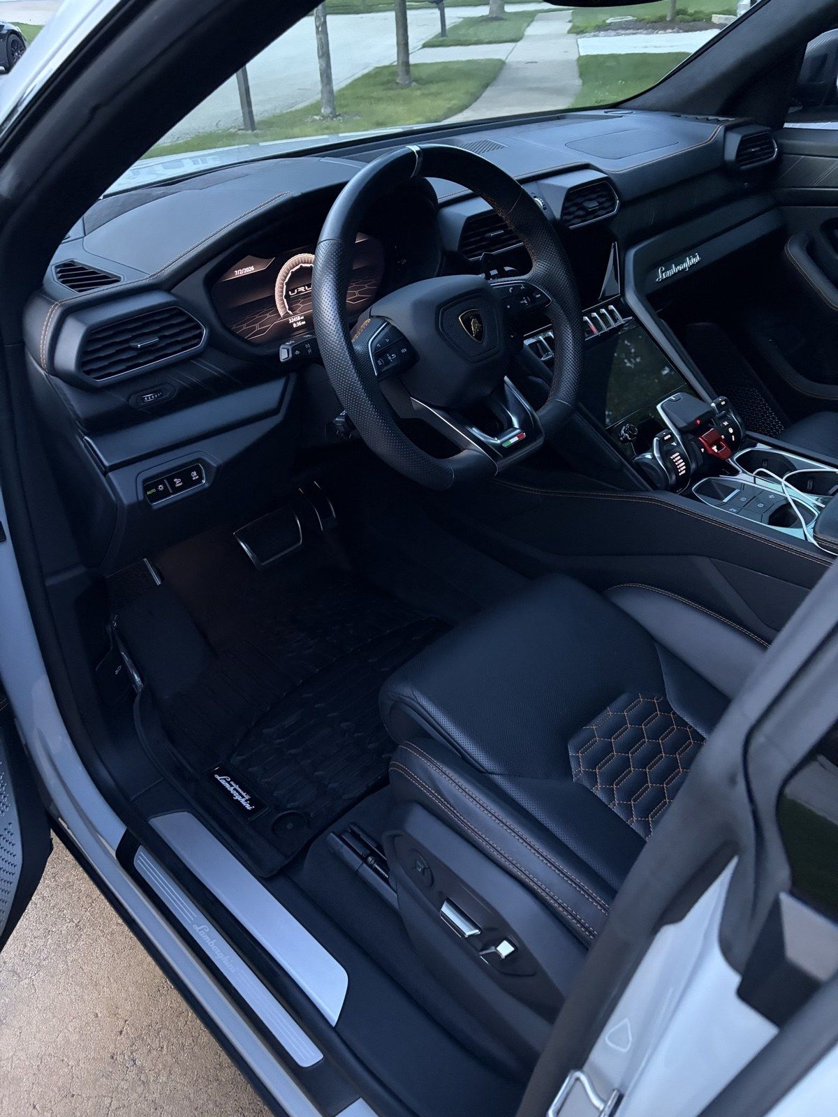 Lamborghini Urus cockpit with hex-stitched leather seats after a full interior detail